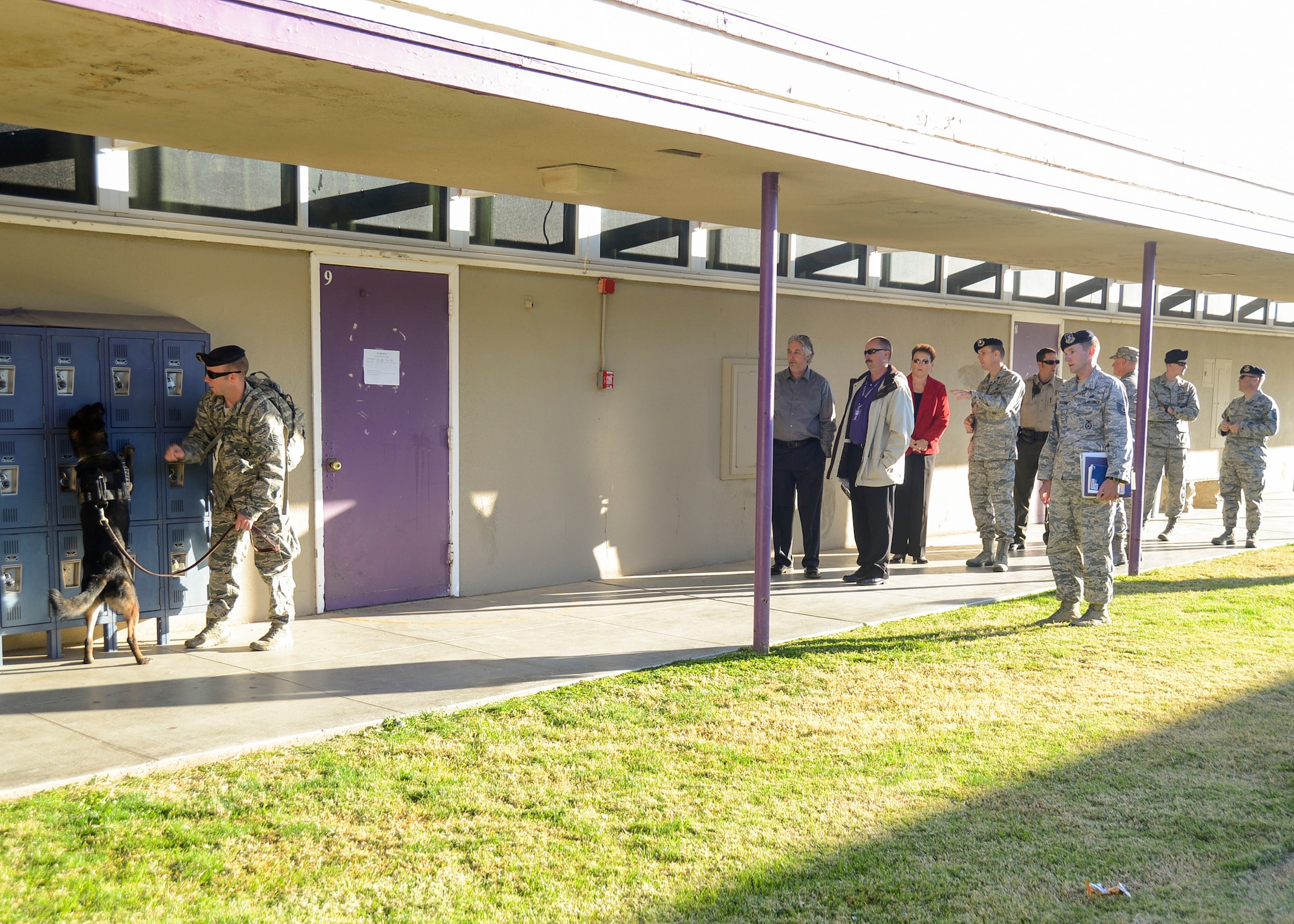 The Kern County Sheriff's Department partnered with the 412th Security Forces Squadron K-9 Unit to conduct a surprise check for any illegal substances at Desert Junior Senior High School Oct. 18. The two law enforcement agencies, along with the Muroc Joint Unified School District, joined together to help kick off Red Ribbon Week, which takes places this week. The national event is conducted to bring awareness and education to school children about the dangers of illegal drug use. (U.S. Air Force photo by Rebecca Amber). 