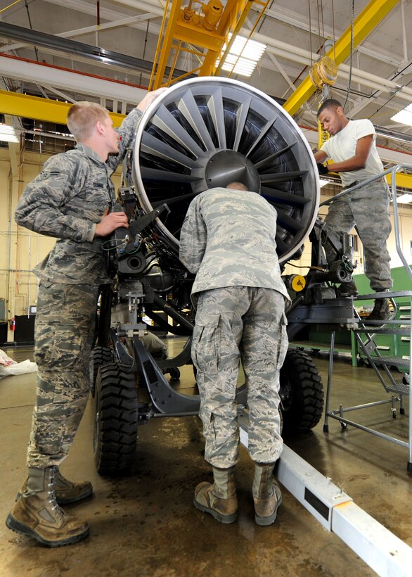 Airmen 1st Class Nicholas Summer (left) and Tyler Carr, and Senior Airman Kymric Walker, 28th Maintenance Squadron aerospace propulsion technicians, inspect a B-1 engine during a preposition spare engine inspection in the propulsion back shop at Ellsworth Air Force Base, S.D., Oct. 17, 2013. Ellsworth’s aerospace propulsion Airmen are responsible for inspecting and performing maintenance on more than 80 B-1 engines. (U.S. Air Force photo by Airman 1st Class Rebecca Imwalle/ Released)