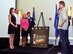 Artist Phil Taylor speaks to the family of Senior Airman Adam Servais before presenting the portrait honoring his service Oct. 19, 2013, in Destin, Fla. Servais, a 23rd Special Tactics Squadron combat controller, was killed in action Aug. 19, 2006 while deployed to Afghanistan. (U.S. Air Force photo by Capt. Victoria Porto)