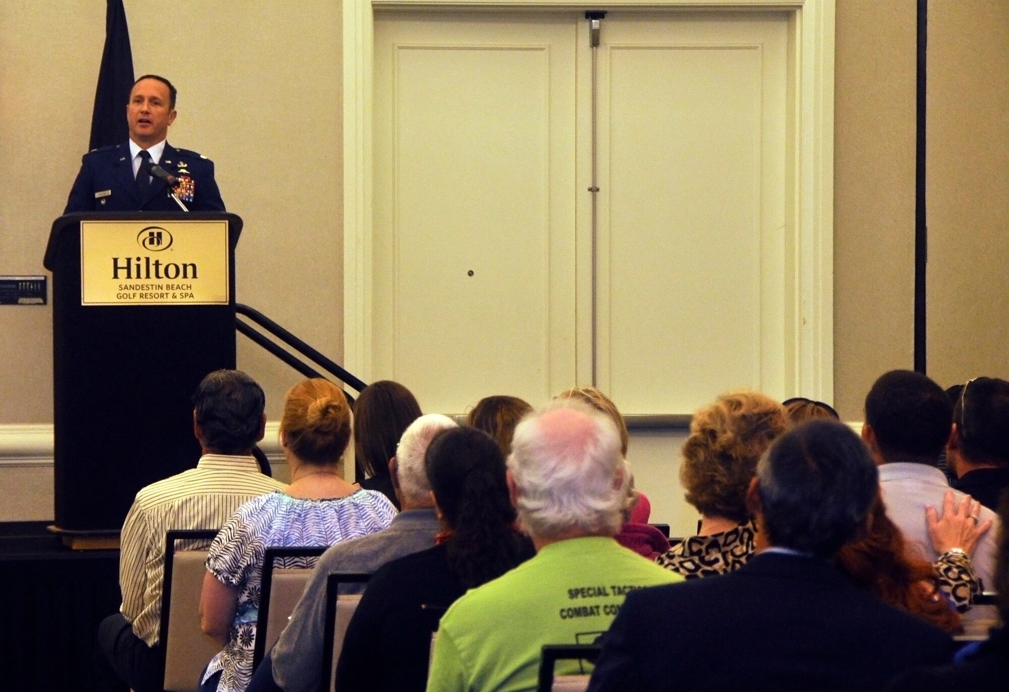 Lt. Col. Michael Flatten, 720th Special Tactics Group deputy commander and former 23rd Special Tactics Squadron director of operations, speaks about Senior Airman Adam Servais during a memorial portrait presentation Oct. 19, 2013, in Destin, Fla. Servais, a 23rd STS combat controller, was killed in action Aug. 19, 2006 while deployed to Afghanistan. (U.S. Air Force photo by Capt. Victoria Porto)