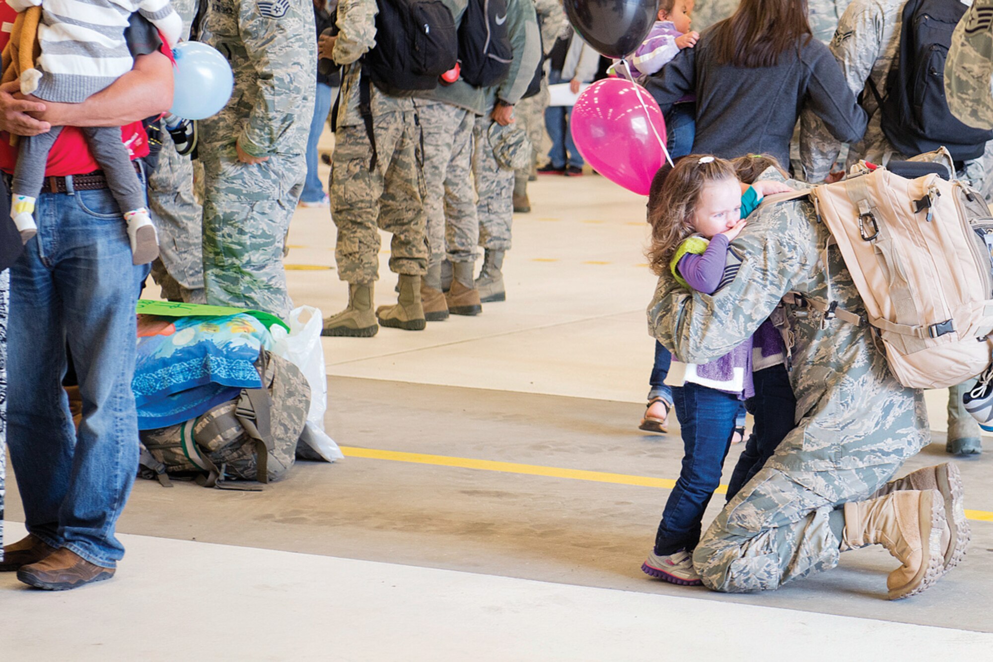 Airmen from the 90th Fighter Squadron and other 3rd Wing units are welcomed by family and friends at the 525th Fighter Squadron's hangar on Joint Base Elmendorf-Richardson, Oct. 7, 2013. The Airmen were deployed for five months providing support for operations in Southwest Asia. (U.S. Air Force photo/Staff Sgt. Zachary Wolf)