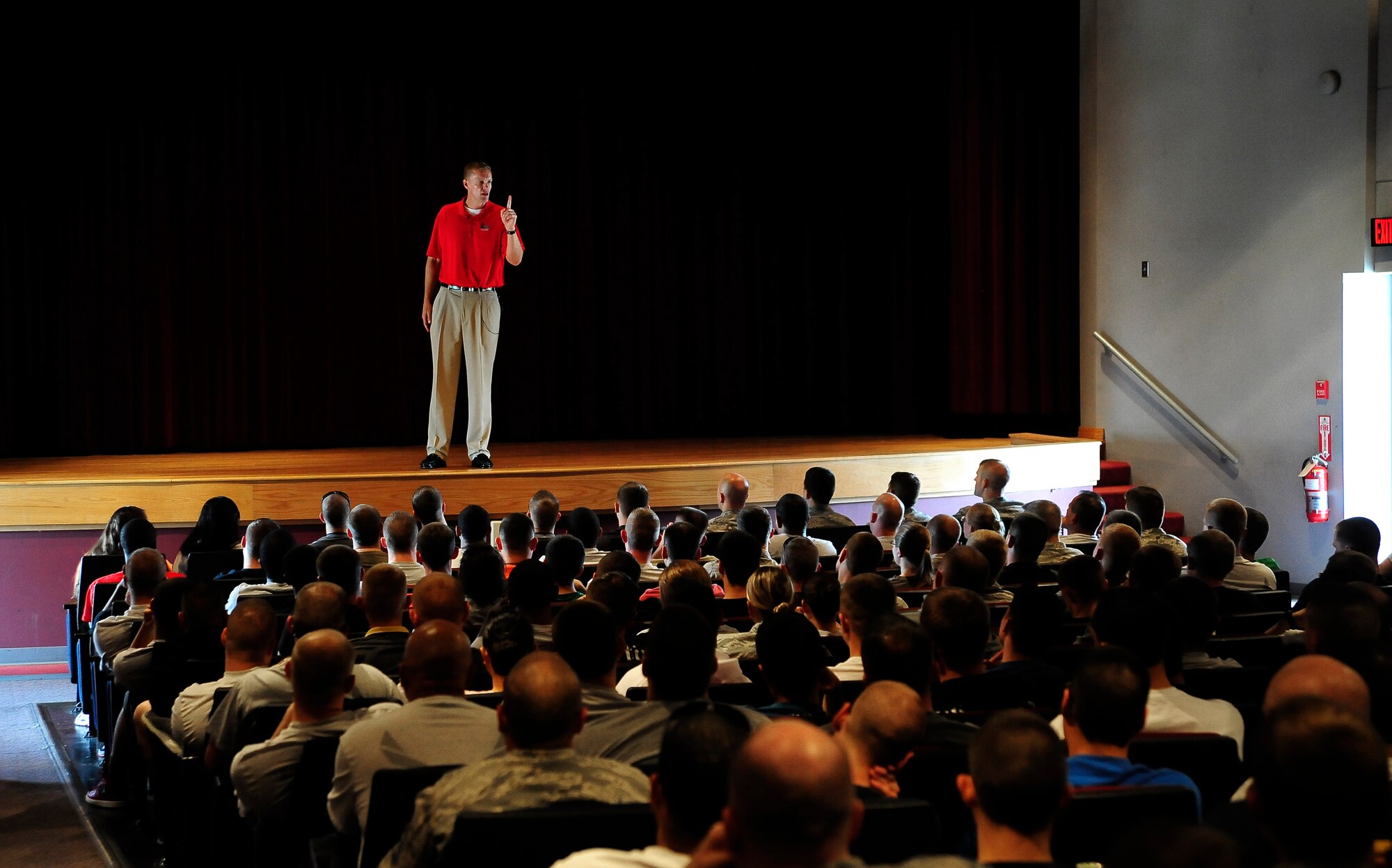 Dr. Dan Gerdes, a sports psychologist from the University of Central Missouri, interacts with Airmen Oct. 10, 2013, during the Community Fair and Wingman Day at Whiteman Air Force Base, Mo. Gerdes’ message focused on the importance of being tough mentally, physically and spiritually.  (U.S. Air Force photo by Staff Sgt. Brigitte N. Brantley/Released)