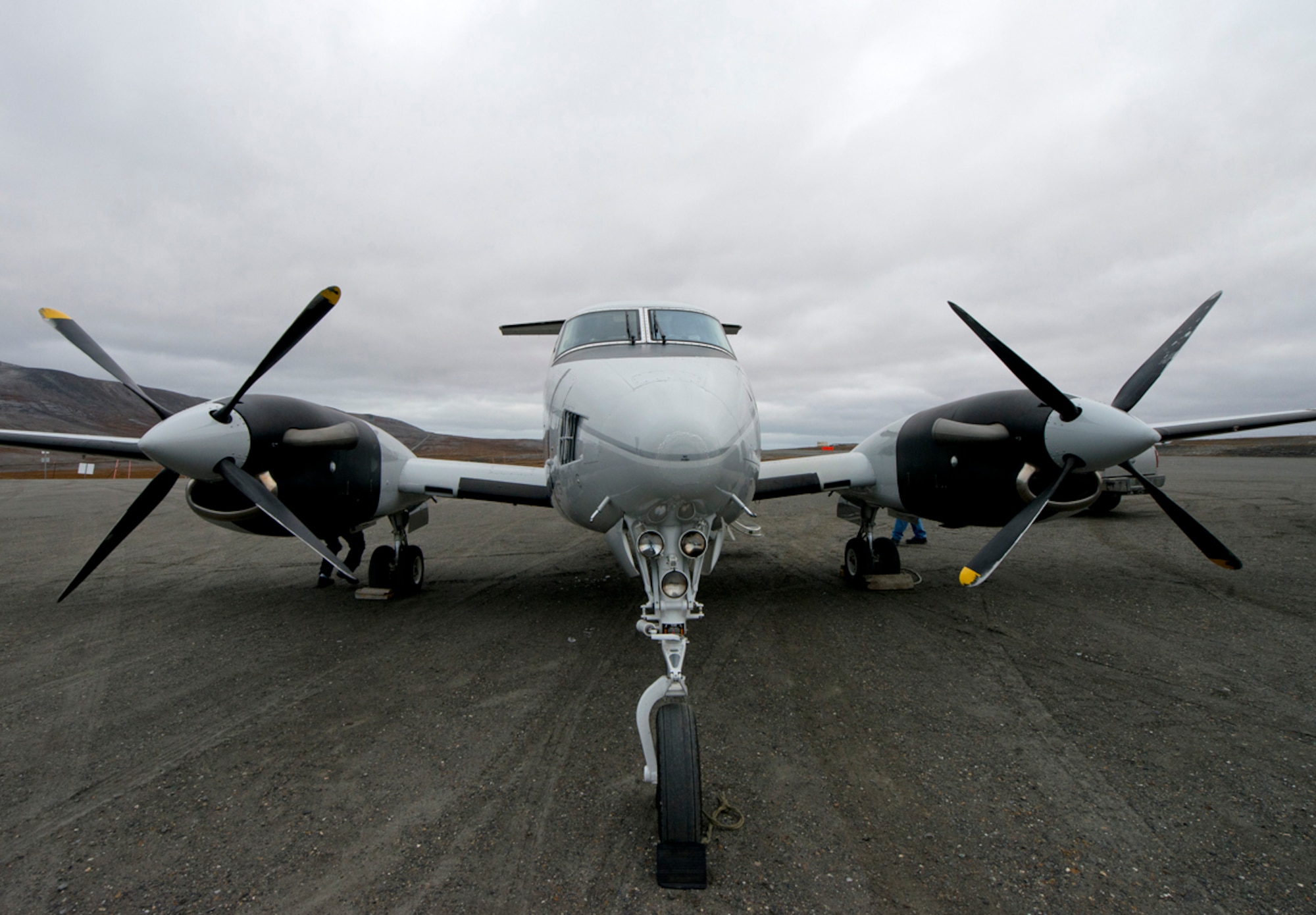 A C-12F Huron sits on the gravel runway at Tin City, a long-range radar site, Sept. 19, 2013. The C-12 took a group from the 611th Air Support Squadron to Tin City to perform a quality check on the site. The C-12 helps support the radar mission by providing transportation for the people that work there and can transport small cargo. (U.S. Air Force photo/Staff Sgt. Zachary Wolf)