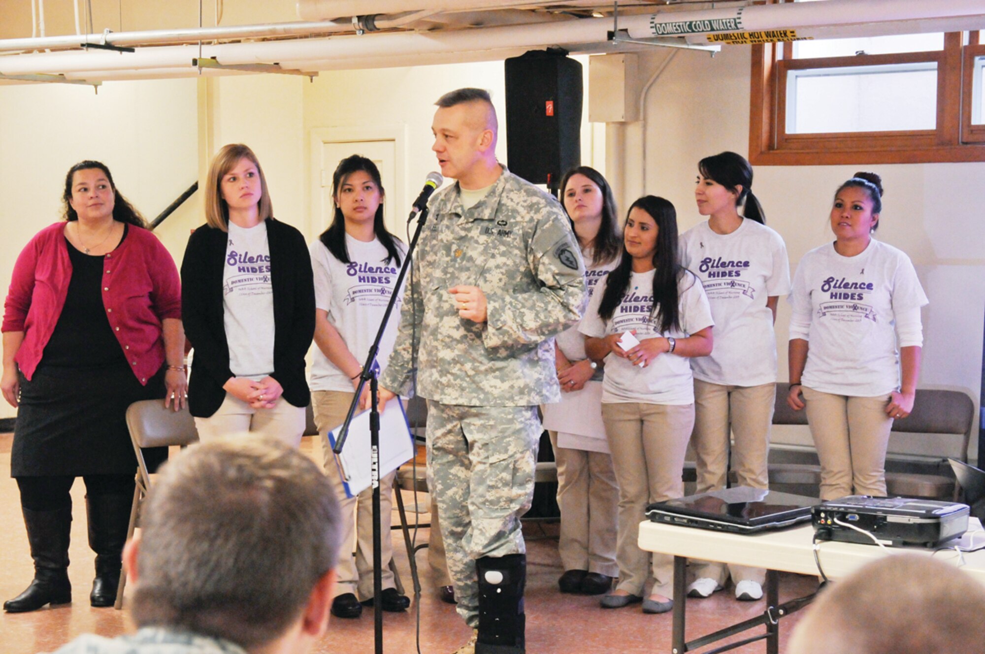 Army Maj. James Lee, the chaplain for the 4th Infantry Brigade Combat Team (Airborne), 25th Infantry Division, addresses command teams from across the brigade on the issue of domestic violence as a group of student-instructors from the University of Alaska Anchorage’s Nursing School look on Oct. 2, 2013, at the Soldiers’ Chapel at Joint Base Elmendorf-Richardson, Alaska. The students were there to give instruction on domestic violence awareness, prevention and response. (U.S. Army photo/Sgt. Eric-James Estrada)