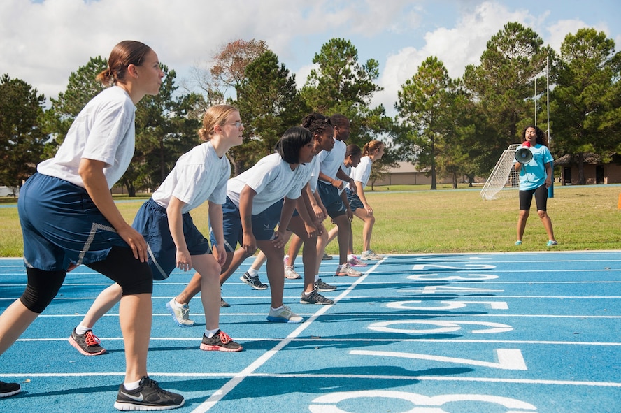 U.S. Air Force Airmen prepare for the 100-meter dash during Super Sports Day at Moody Air Force Base, Ga., Oct. 18, 2013. Throughout the day, units competed in multiple sporting events, including basketball, dodgeball and racquetball. (U.S. Air Force photo by Airman Dillian Bamman/Released)