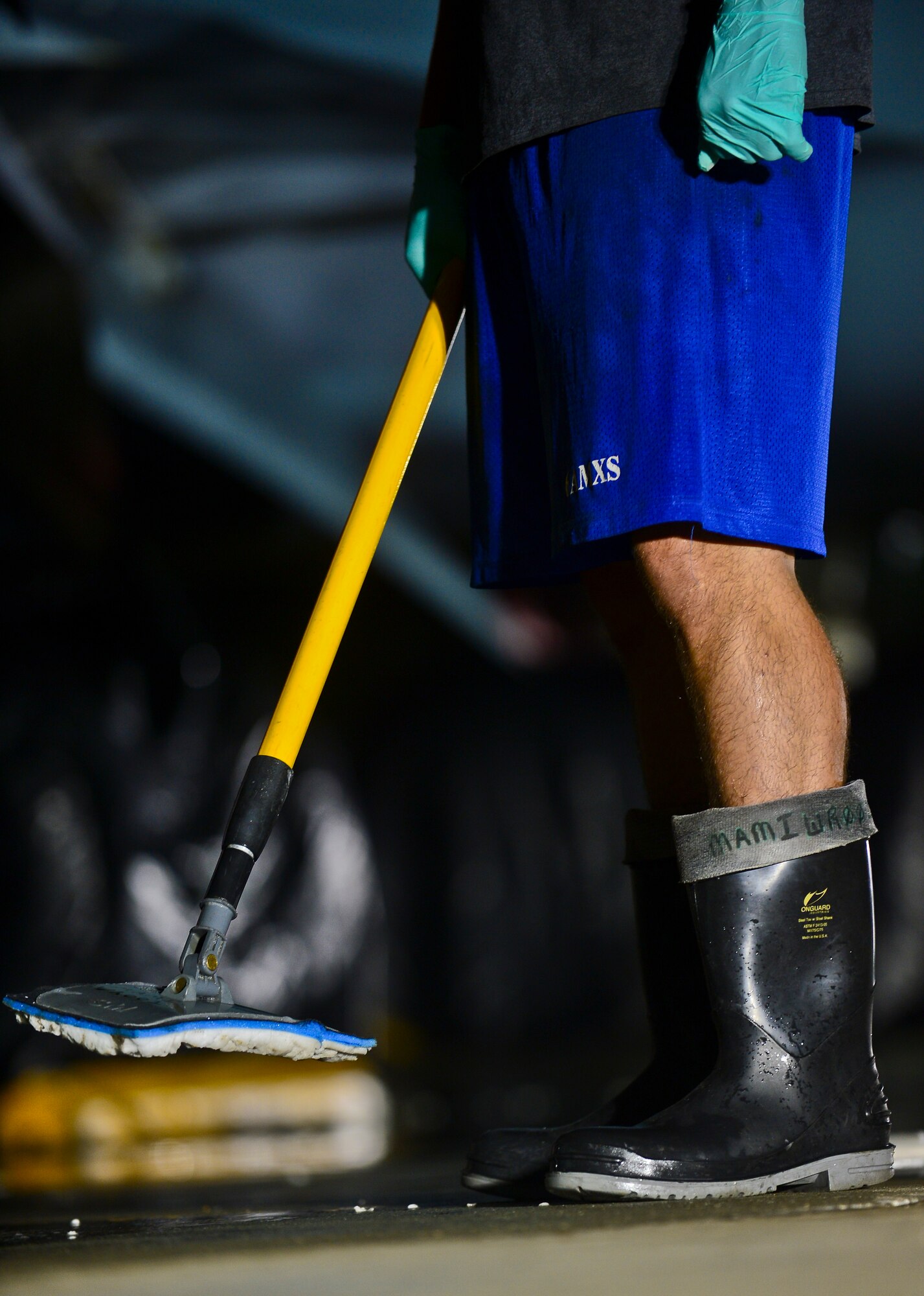 An Airman assigned to the 6th Aircraft Maintenance squadron “aircraft wash crew,” stands near a bucket of corrosion preventative wash, Oct. 16, 2013, MacDill Air Force Base, Fla. Each of MacDill’s 16 KC-135 Stratotankers must be thoroughly washed once a month to prevent any structural damage caused by the salinity that is common in the geographical location. (U.S. Air Force photo by Staff Sgt. Brandon Shapiro/Released) 