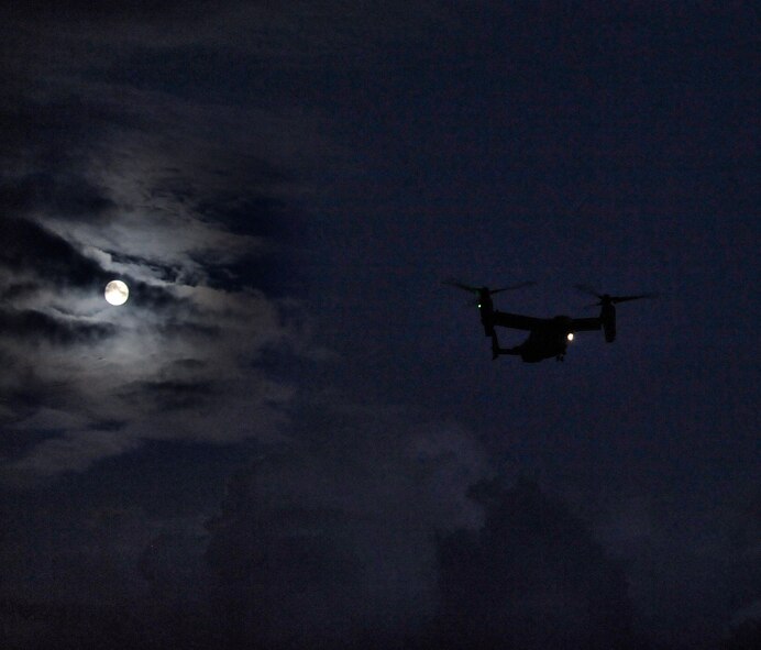 A CV-22 Osprey flies over the Santa Rosa Sound to pick up two pararescuemen Oct. 17, 2013. The pararescuemen, from the 23rd Special Tactics Squadron, were being picked up as part of a night training exercise. (U.S. Air Force photo/Staff Sgt. Jeff Andrejcik)