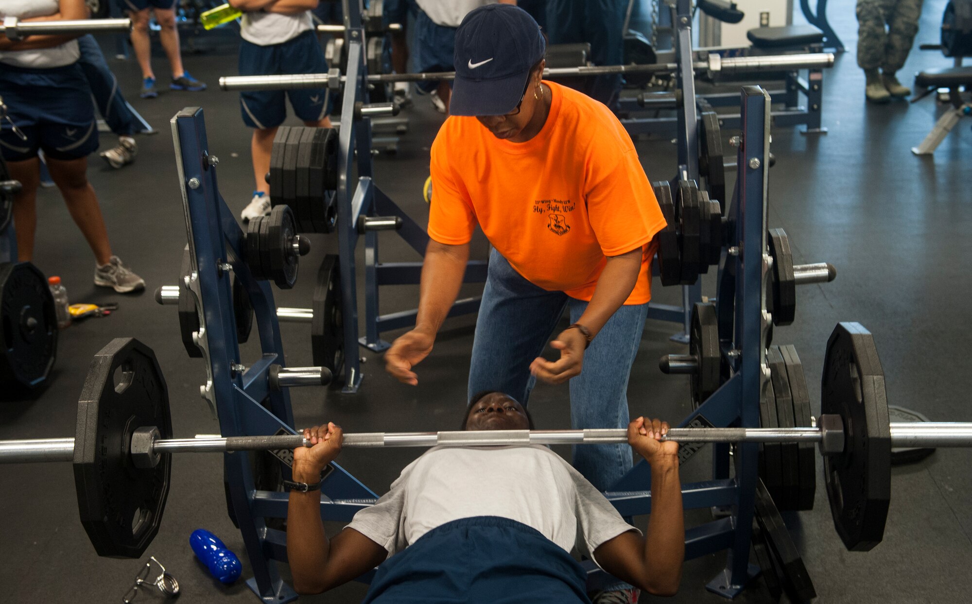 U.S. Air Force Capt. Vanessa Jessie, 23d Wing chief of protocol, bench presses 135 pounds during a lifting competition for Super Sports Day at Moody Air Force Base, Ga., Oct. 18, 2013. There were six women who competed in this competition, which was part of Super Sports Day. (U.S. Air Force photo by Airman 1st Class Alexis Grotz/Released)
