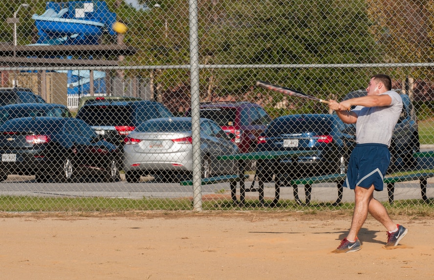 U.S. Air Force Airman 1st Class Aaron Avila, 23d Security Forces Squadron response force member, hits the ball during Super Sports Day at Moody Air Force Base, Ga., Oct. 18, 2013. The goal of a homerun derby is to hit as many homeruns as possible with a limited number of pitches. (U.S. Air Force photo by Airman 1st Class Alexis Grotz/ Released)
