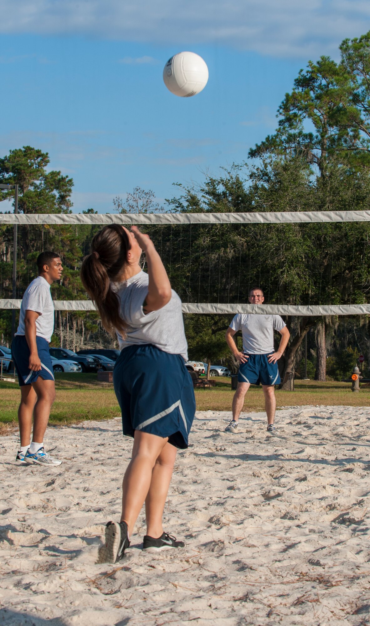 U.S. Air Force Airman 1st Class Sydney Vidaurri, 23d Medical Operations Squadron physical therapy technician, serves the volleyball during Super Sports Day at Moody Air Force Base, Ga., Oct. 18, 2013. Each volleyball team had four players with an optional fifth member to rotate in. (U.S. Air Force photo by Airman 1st Class Alexis Grotz/Released)