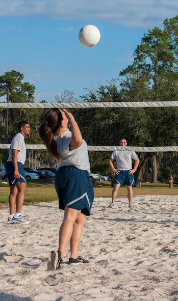 U.S. Air Force Airman 1st Class Sydney Vidaurri, 23d Medical Operations Squadron physical therapy technician, serves the volleyball during Super Sports Day at Moody Air Force Base, Ga., Oct. 18, 2013. Each volleyball team had four players with an optional fifth member to rotate in. (U.S. Air Force photo by Airman 1st Class Alexis Grotz/Released)