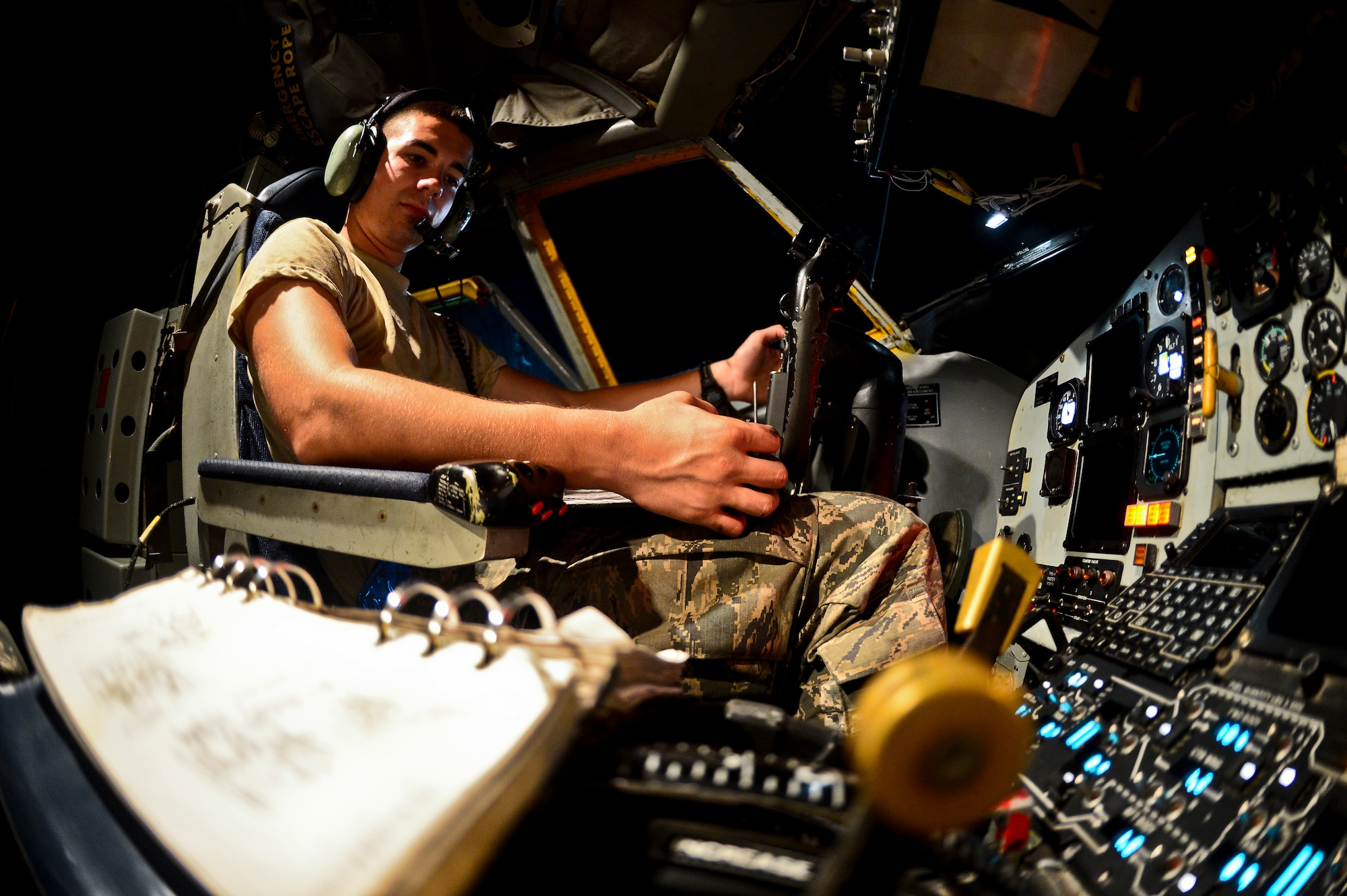 Airman 1st Class Jordan Johnson, 6th Aircraft Maintenance Squadron crew chief, watches the fuel load of a KC-135 Stratotanker as it is returned to flight ready condition, Oct. 10, 2013 at MacDill Air Force Base, Fla. The KC-135 can hold up to 200,000 lbs. of fuel and can double as a medical evacuation aircraft. (U.S. Air Force photo by Staff Sgt. Brandon Shapiro/Released)