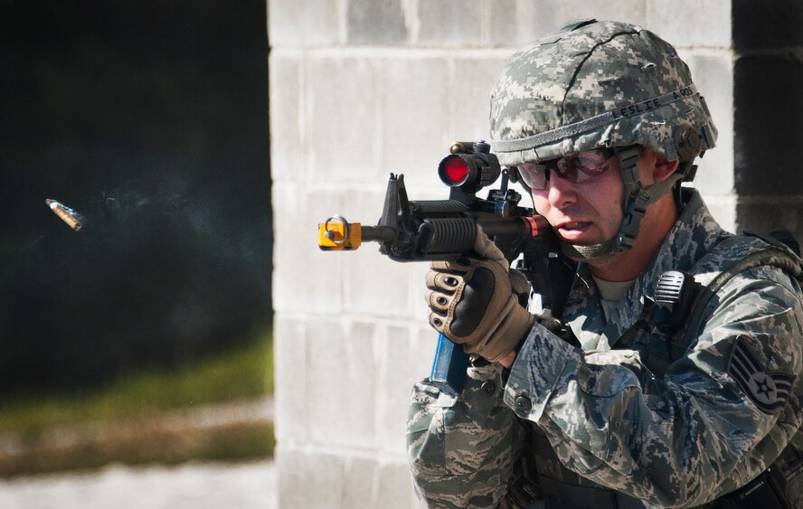 Staff Sgt. Richard Leslie, of the 96th Ground Combat Training Squadron, fires a round from his M-4 rifle during a demonstration exercise Oct. 16 at Eglin Air Force Base, Fla.  Approximately 1,500 active-duty, reserve and National Guard Airmen attend the squadron’s "Brave Defender" training each year.  "Defender" is a six-week deployment training course for security forces Airmen. It is one of only six SF deployment training courses in the U.S. The course opened here in 2002 and was established by Air Force Materiel Command to satisfy security forces training requirements in an expeditionary environment (U.S. Air Force photo/Samuel King Jr.)