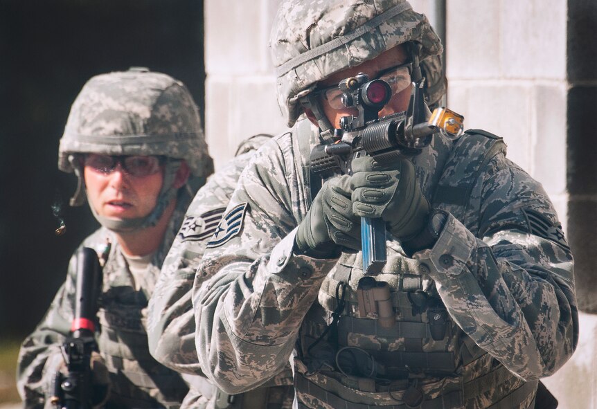 Staff Sgt. Juan Barnes, of the 96th Ground Combat Training Squadron, fires a round from his M-4 rifle during a demonstration exercise Oct. 16 at Eglin Air Force Base, Fla.  Approximately 1,500 active-duty, reserve and National Guard Airmen attend the squadron’s "Brave Defender" training each year.  "Defender" is a six-week deployment training course for security forces Airmen. It is one of only six SF deployment training courses in the U.S. The course opened here in 2002 and was established by Air Force Materiel Command to satisfy security forces training requirements in an expeditionary environment (U.S. Air Force photo/Samuel King Jr.)