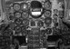 Inside the cockpit of the RF-84 shows a myriad of instruments. Unique items in the Thunderflash are the view finder (top center) a large optic that allowed the pilot see what was being photographed through the lens of the camera and four camera control units in the lower center portion of the photograph.
Iowa Air Guard Photo