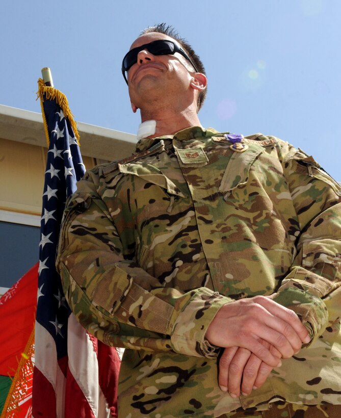 U.S. Air Force Tech. Sgt. James Juniper, NATO Air Training Command-Afghanistan special mission aviator advisor, received the Purple Heart October 10, 2013 at Kandahar Airfield, Afghanistan, for wounds sustained during a Mi-17 helicopter mission near Gizab, Afghanistan. The October 8, 2013 mission was a troop movement mission transporting Afghan National Army commandos from Tarin Khowt Airfield in Uruzgan Province to the district of Gizab. The helicopter was engaged by small arms fire and rocket propelled grenades from multiple locations. (U.S. Air Force photo/Senior Airman Jack Sanders)