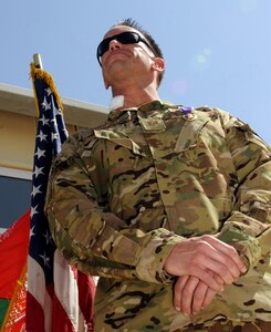 U.S. Air Force Tech. Sgt. James Juniper, NATO Air Training Command-Afghanistan special mission aviator advisor, received the Purple Heart October 10, 2013 at Kandahar Airfield, Afghanistan, for wounds sustained during a Mi-17 helicopter mission near Gizab, Afghanistan. The October 8, 2013 mission was a troop movement mission transporting Afghan National Army commandos from Tarin Khowt Airfield in Uruzgan Province to the district of Gizab. The helicopter was engaged by small arms fire and rocket propelled grenades from multiple locations. (U.S. Air Force photo/Senior Airman Jack Sanders)