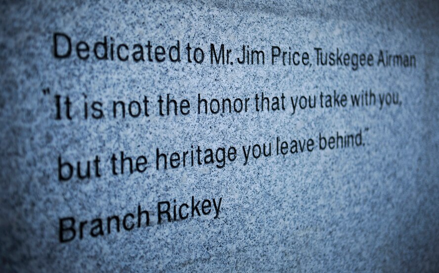 The quote on the statue dedicated to retired Master Sgt.  Jim Price, a Tuskegee Airman and a former member of the Osan community, is visible to any onlooker in front of the Osan Enlisted Club at Osan Air Base, Republic of Korea. The statue was unveiled Oct. 18, 2013, to honor enlisted heritage and Price’s legacy. (U.S. Air Force photo/Staff Sgt. Sara Csurilla)