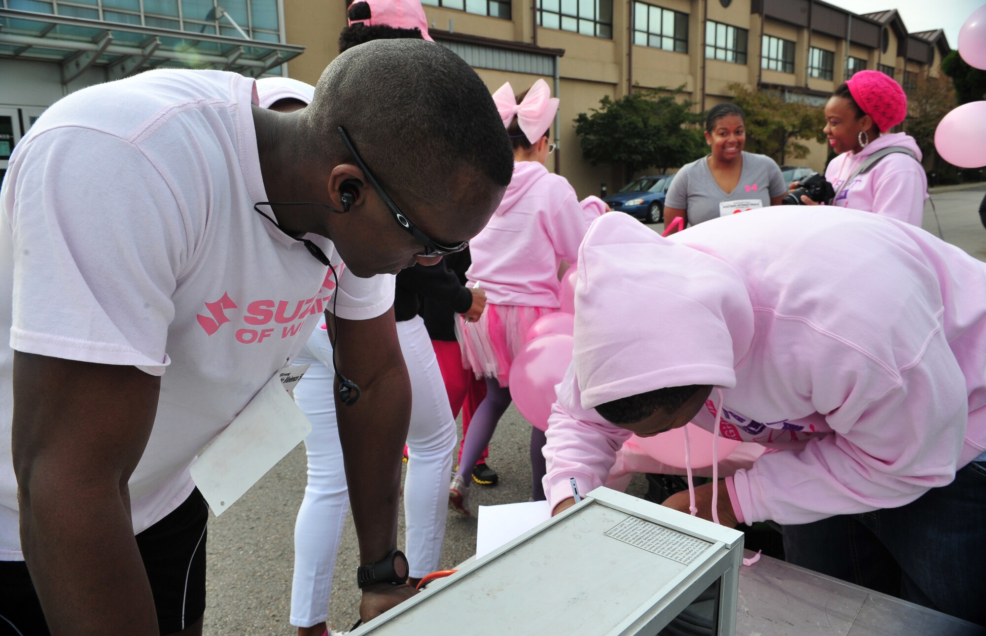Senior Airman Moses Tum, 7th Air Force budget analyst, checks in after finishing a Breast Cancer and Domestic Violence Awareness 5K at Osan Air Base, Republic of Korea, Oct. 19, 2013. Tum was the fastest male runner, with a time of 17:16. (U.S. Air Force photo/Airman 1st Class Ashley J. Thum)