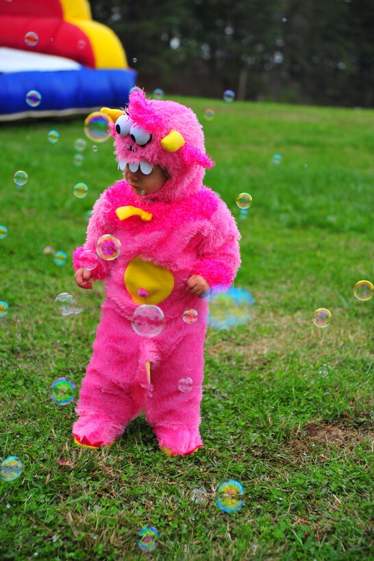 Adriannia, 1, plays in a field of bubbles during the 2nd Annual Fall Festival hosted at Weapons Training Battalion on Oct. 19, 2013. The festival gives Marines and their families the chance to meet each other. 
