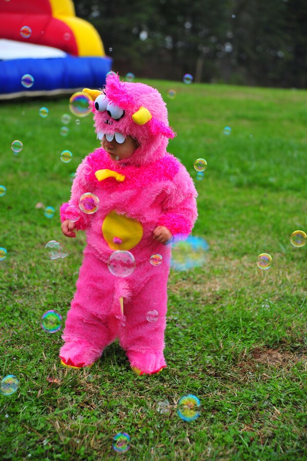 Adriannia, 1, plays in a field of bubbles during the 2nd Annual Fall Festival hosted at Weapons Training Battalion on Oct. 19, 2013. The festival gives Marines and their families the chance to meet each other. 
