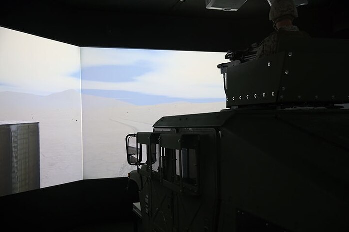 A Marine with 2nd Medical Battalion, Combat Logistics Regiment 25, 2nd Marine Logistics Group mans the turret of a High Mobility Multipurpose Wheeled Vehicle simulator during a virtual convoy at the Lockheed Martin Combat Convoy Simulator aboard Camp Lejeune, N.C., Oct. 18, 2013. Approximately 40 Marines conducted simulated convoys and immediate action drills during different simulated scenarios.