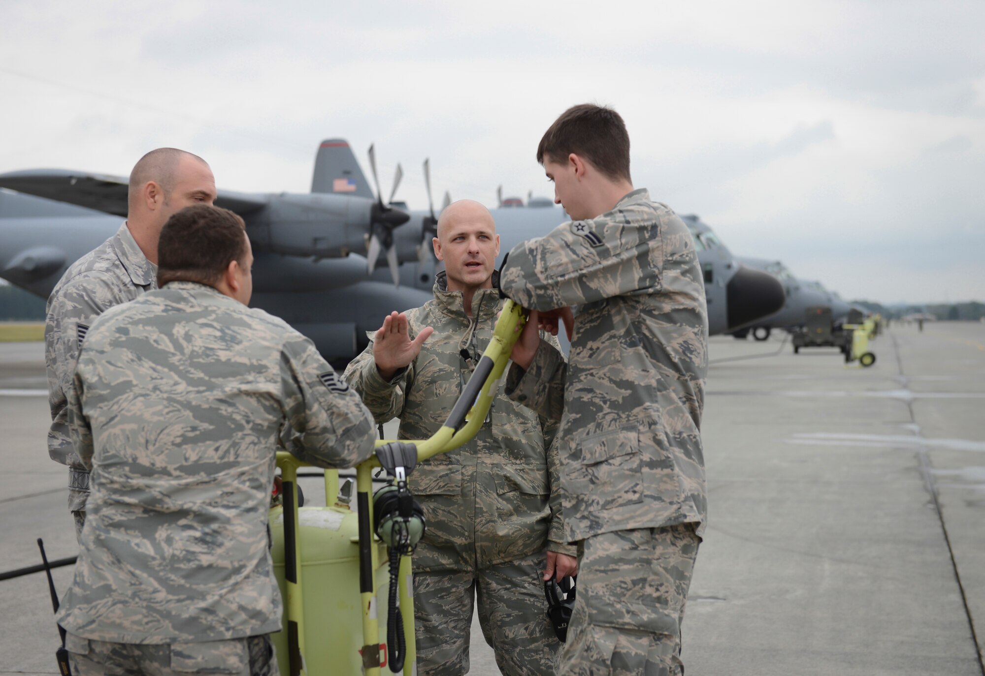 Major Nicholas Pedersen, Aircraft Maintenance Squadron commander, speaks to a group of Airmen at Yokota Air Base, Japan, Oct. 22, 2013.  A surge tests and shows the professional airlift capabilities Yokota has to offer. (U.S. Air Force photo by Airman 1st Class Meagan Schutter/Released)