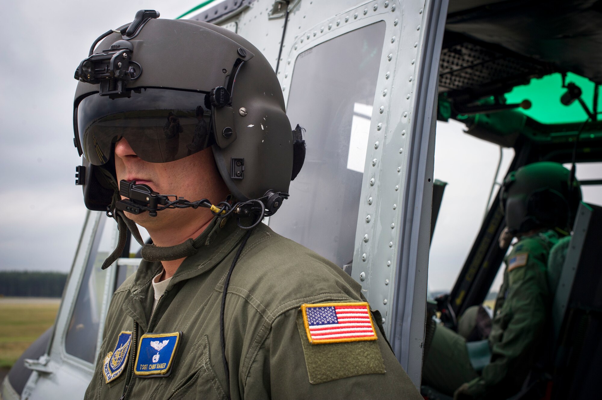 Tech. Sgt. Chris Baker, 374th Operations Group flight engineer, prepares to board a UH-1 Huey helicopter Oct. 22, 2013, during a large formation mission conducted at Yokota Air Base, Japan. The wing conducts large formation flights to test its capability to prepare and launch multiple aircraft at the same time, highlighting Yokota’s mission as the primary Western Pacific airlift hub for peacetime and contingency operations. (U.S. Air Force photo by Staff Sgt Stacy Moless/released)