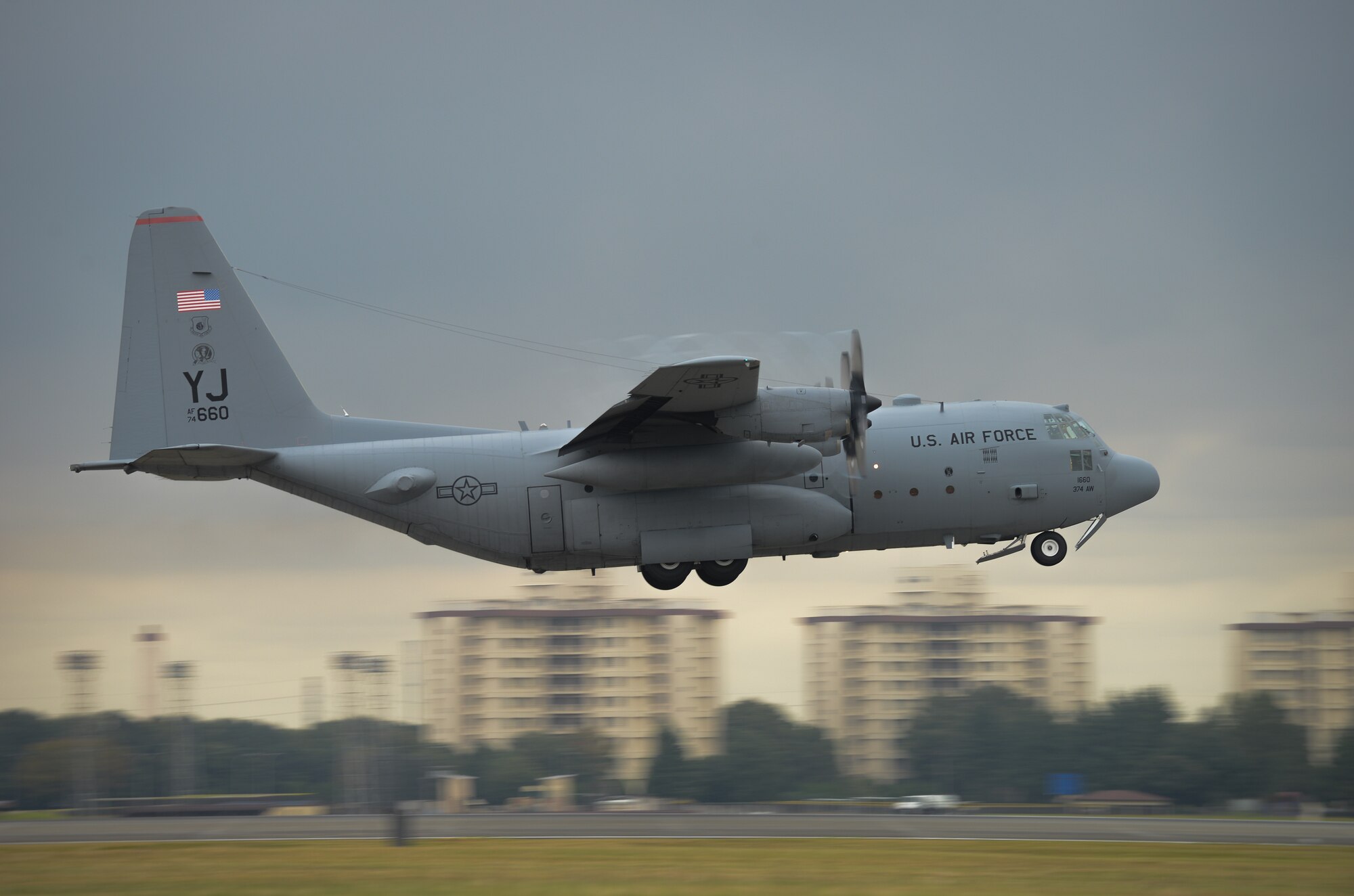 A C-130 Hercules takes off at Yokota Air Base, Japan, Oct. 22, 2013.  Ten C-130's flew in formation practicing airlift tactics and procedures. (U.S. Air Force photo by Airman 1st Class Meagan Schutter/Released)