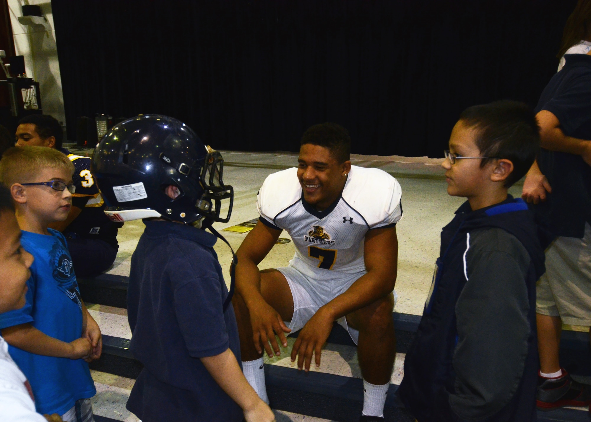 Guam High School football team member, Tegan Brown, talks to students during an anti-bullying ceremony, Oct. 17, 2013, at Andersen Elementary School, on Andersen Air Force Base, Guam.  Members of the football team visited different classes throughout the school, and spoke about how to prevent and report anti-bullying. (U.S. Air Force photo by Senior Airman Cierra Presentado/Released)