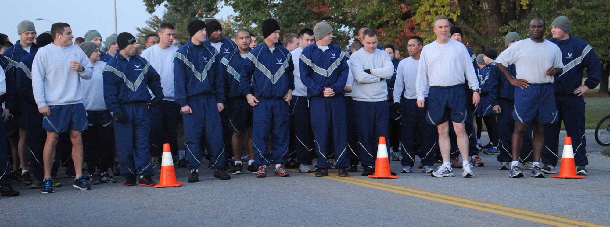 Members of Team Fairchild get ready for the wing run at Fairchild Air Force Base, Wash. Oct. 18, 2013. The run covers about 1.5 miles around the base, starting and ending at Miller Park. (U.S. Air Force photo by Senior Airman Samantha Krolikowski/ Released)