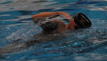 A candidate for Combat Rescue Officer selection takes a breath while swimming during phase two of CRO selection at Fairchild Air Force Base, Wash., Oct. 16, 2013. The goal of Phase II is to place the candidates under extreme fatigue and constant stress to see how they think and act under circumstances that are similar to the real world battlefront. (U.S. Air Force photo by Senior Airman Samantha Krolikowski/ Released)