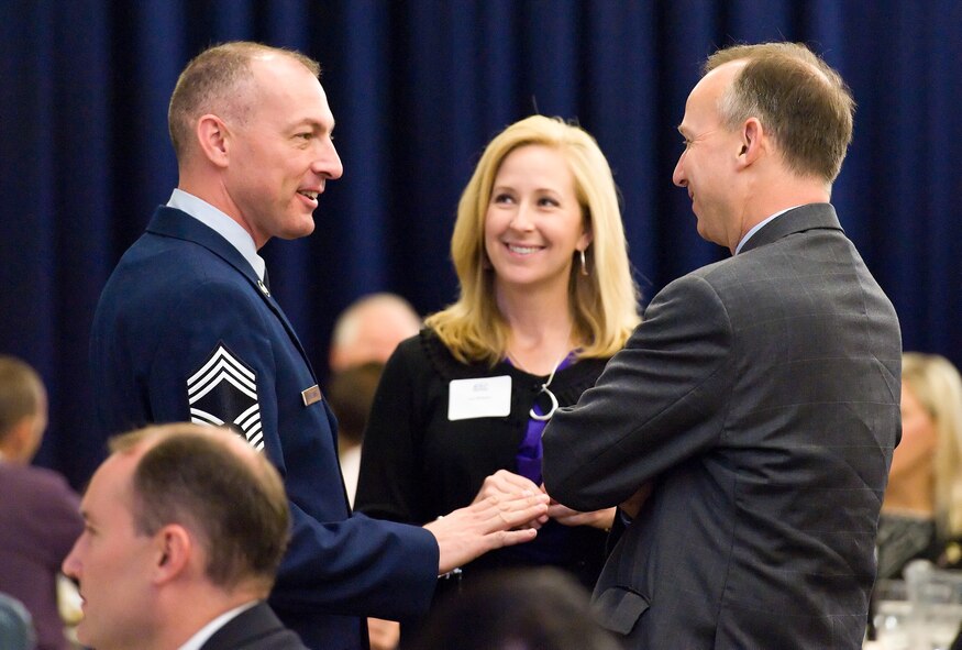 Chief Master Sgt. Larry Williams, 436th Operations Support Squadron superintendent, and his wife, Lisa, speak with Delaware Governor Jack Markell, Oct. 21, 2013, at The Landings on Dover Air Force Base, Del. Markell and other congressional delegates from Delaware attended the 2013 Military Construction breakfast and briefing hosted by the Central Delaware Chamber of Commerce. (U.S. Air Force photo/Roland Balik)