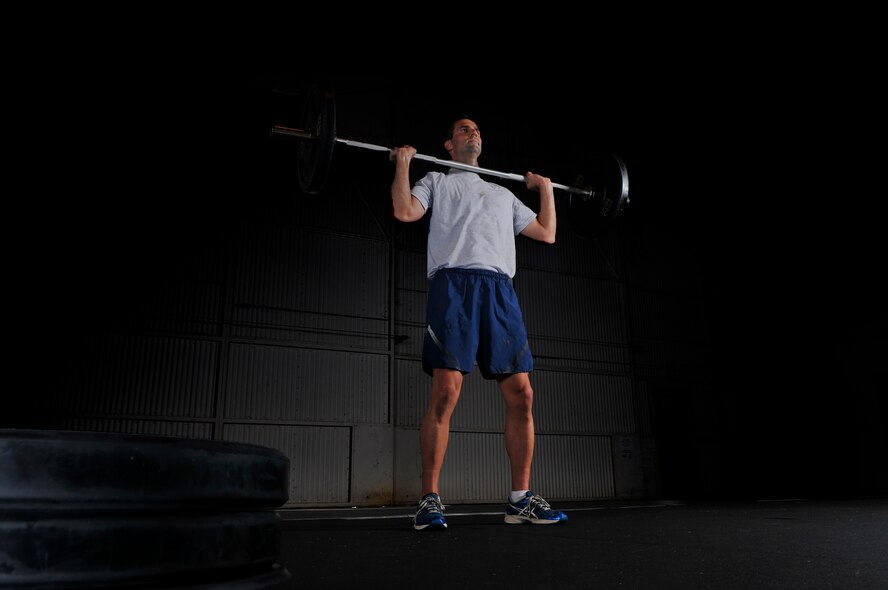 Capt. Ryan Shaver, 42nd Medical Group, scored 100 on his U.S. Air Force physical fitness assessment test. Airmen who score 100 at Maxwell Air Force base are members of "Club 100," and are highlighted for their achievement. Shaver runs, lifts weights and does push-ups every day to keep in top physical shape. (U.S. Air Force photo illustration by Senior Airman Natasha Stannard/Released)