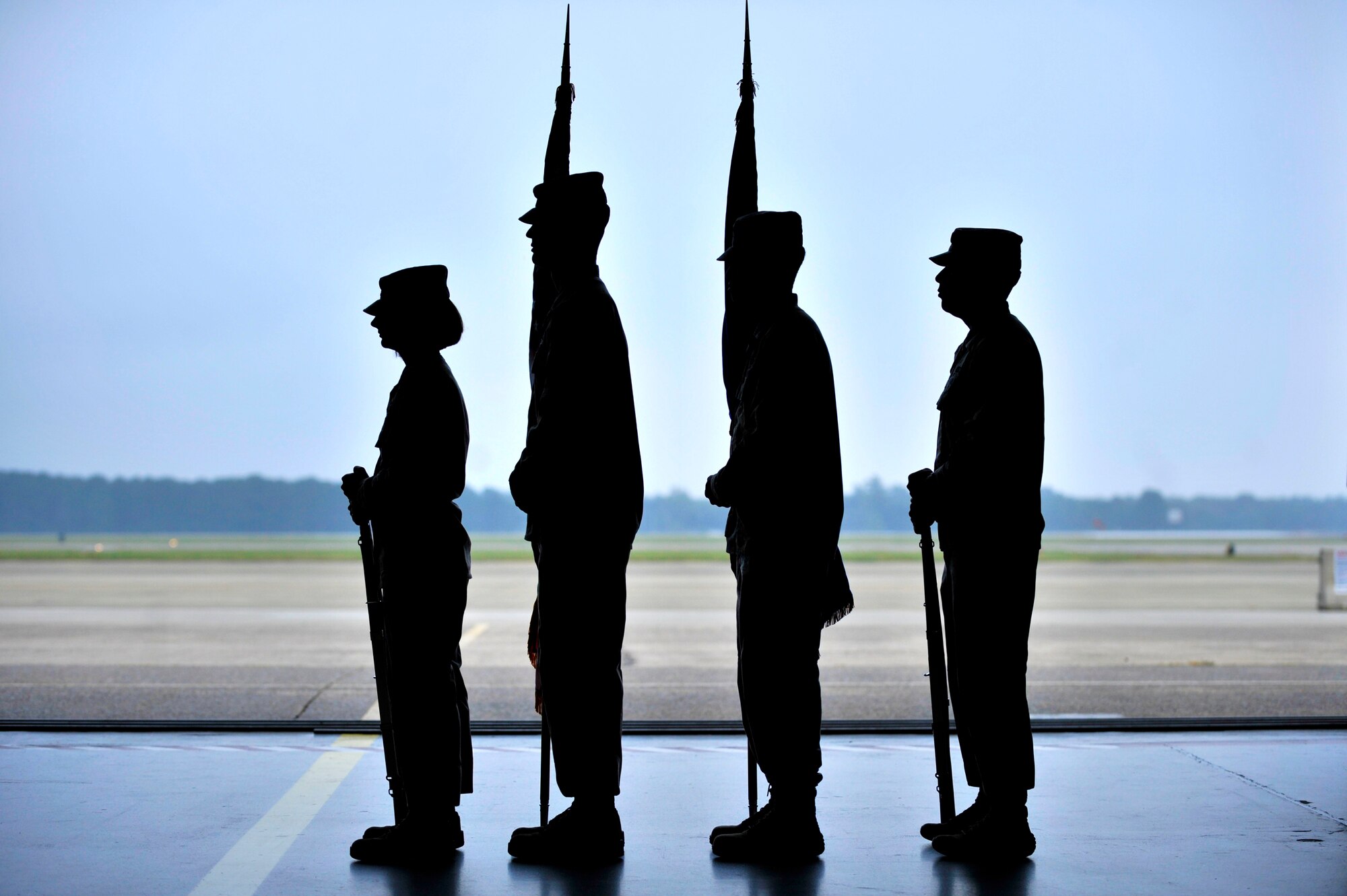 U.S. Air Force Honor Guard members stand at attention during Lt. Col. Neil Neaderhiser’s, 609th Air and Space Operations Center Chief of Contingency Operations, retirement ceremony Oct. 18, 2013, at Shaw Air Force Base, S.C. Neaderhiser gathered with family, friends and co-workers to celebrate his 21-year career in the Air Force. (U.S. Air Force photo by Airman 1st Class Jensen Stidham/Released)