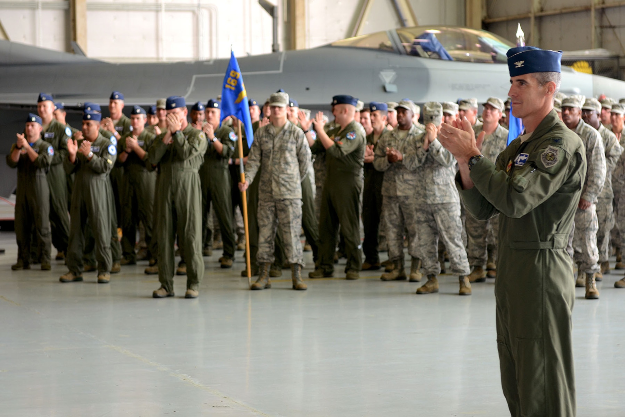 U.S. Air Force Airmen with the 169th Fighter Wing at McEntire Joint National Guard Base, South Carolina Air National Guard, assemble during an awards formation to recognize their accomplishments during a recent Certified Readiness Exercise, Oct. 6, 2013. Through their professionalism and hard work, the Swamp Fox Airmen garnered a much coveted "EXCELLENT" grade from the Air Combat Command's Inspector General. The exercise assessed their ability to operate safely and efficiently in a deployed chemical combat environment. (U.S. Air National Guard photo by Tech. Sgt. Caycee Watson/Released)