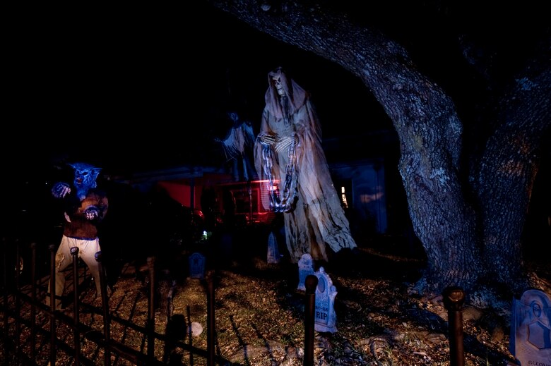 Ghostly figures dangle from the tree of  Master Sgt. Craig Musselman, 10th Combat Weather Squadron operations superintendent, at Hurlburt Field, Fla., Oct. 15, 2013. Several base housing residents have decorated their homes in anticipation for Halloween. Trick-or-treating will be 5:30 to 8:30 p.m. Oct. 31 in base housing. (U.S. Air Force Photo/Staff Sgt. John Bainter)