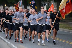 U.S. Army Soldiers assigned to the 7th Sustainment Brigade, Special Troops Battalion, complete a 4-mile run Oct. 4, 2013, at Fort Eustis, Va. The weekly run is held to build camaraderie and keep in standards with the fitness program. (U.S. Air Force photo by Staff Sgt. Ciara Wymbs/Released)  