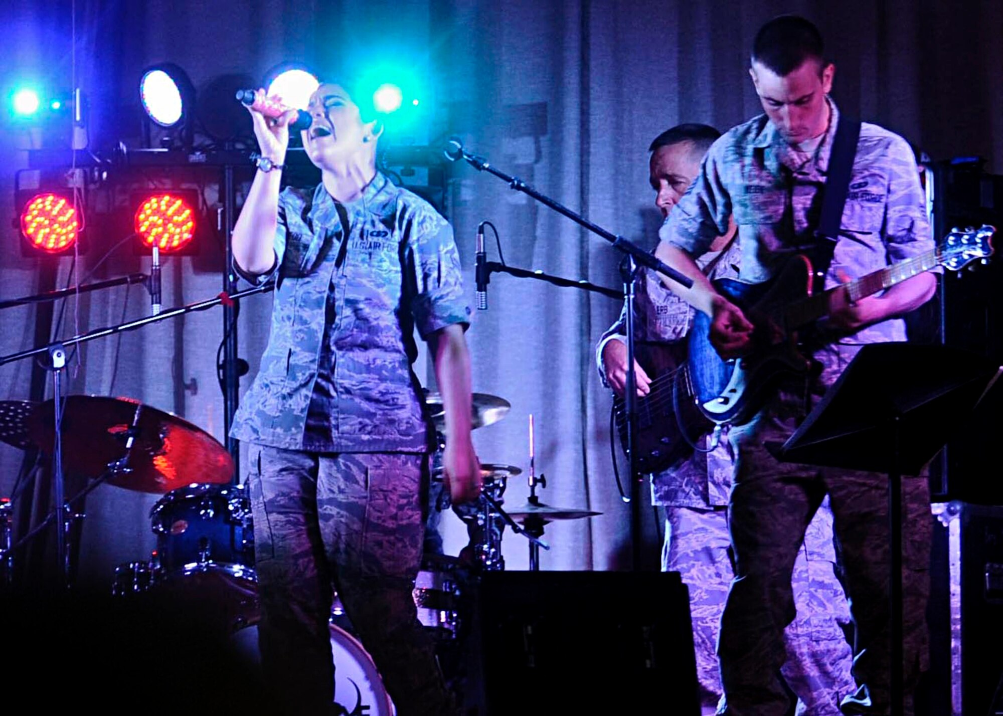 Members of the U.S. Air Force Heritage of America Band’s rock ensemble, “Full Spectrum,” perform at Armstrong Elementary School in Hampton, Va., Oct. 18, 2013. The show was part of a cultural exchange initiative designed to take advantage of the band’s partnership-building missions while touring Asia, giving the students an opportunity to learn about different cultures. (U.S. Air Force photo by Airman 1st Class R. Alex Durbin/Released)