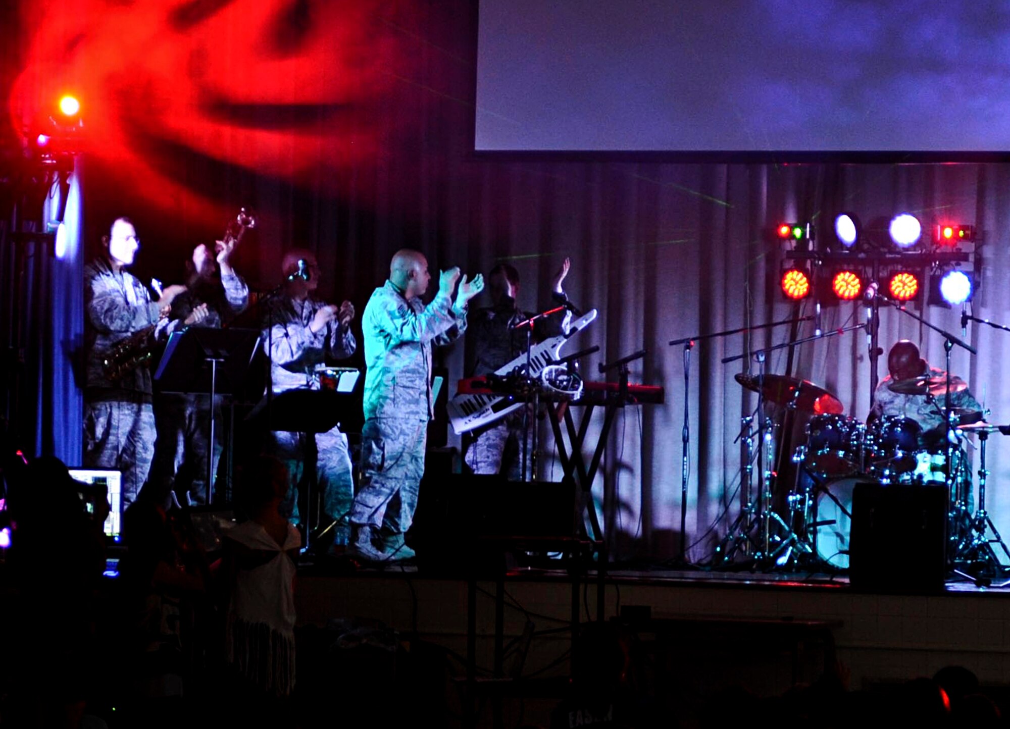 Members of the U.S. Air Force Heritage of America Band’s rock ensemble, “Full Spectrum,” perform at Armstrong Elementary School in Hampton, Va., Oct. 18, 2013. The event was the culmination of a cultural exchange program the ensemble started with Armstrong students in April 2013 when the band visited the school before their deployment to Asia. (U.S. Air Force photo by Airman 1st Class R. Alex Durbin/Released)