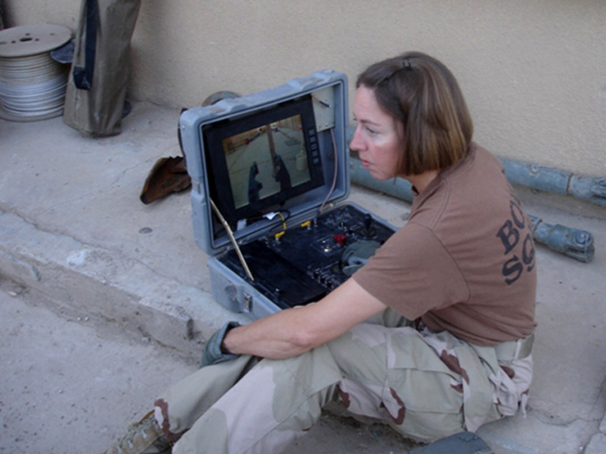 U.S. Air Force Tech. Sgt. Michelle Barefield, explosive ordnance disposal specialist, conducts an operations check for a remote-controlled robot while supporting contingency operations in Iraq, April 14, 2006. Barefield was awarded a Bronze Star for her actions while serving in Iraq. (U.S. Air Force photo)