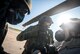 From left, U.S. Air Force Master Sgt. Tony Bell, Airman 1st Class Michael Romero and Tech. Sgt. Andrew Medford, 347th Operations Support Squadron aircrew flight equipment (AFE) technicians, finish putting on mission-oriented protective posture (MOPP) gear at Moody Air Force Base, Ga., Oct. 17, 2013. The AFE technicians suited up to demonstrate the correct way to launch an aircraft in MOPP 4. (U.S. Air Force photo by Senior Airman Jarrod Grammel/Released)
