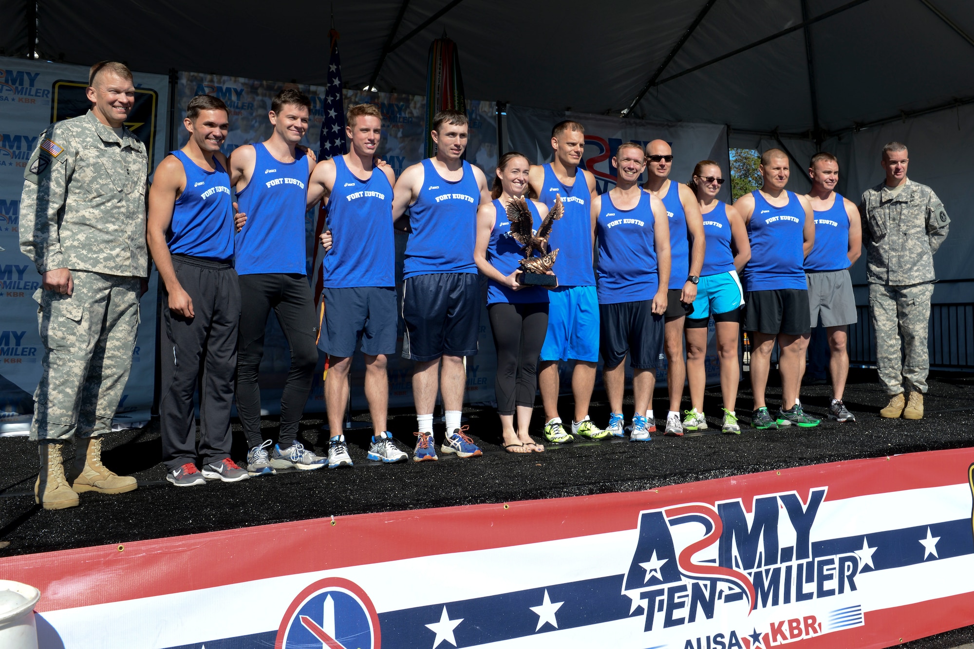 The Fort Eustis Ten-Mile team receives their trophy after the U.S. Army Ten-Miler race, Oct. 20, 2013 in Washington, D.C. The team placed third in last year’s race. (U.S. Air Force photo by Staff Sgt. Ciara Wymbs/Released)