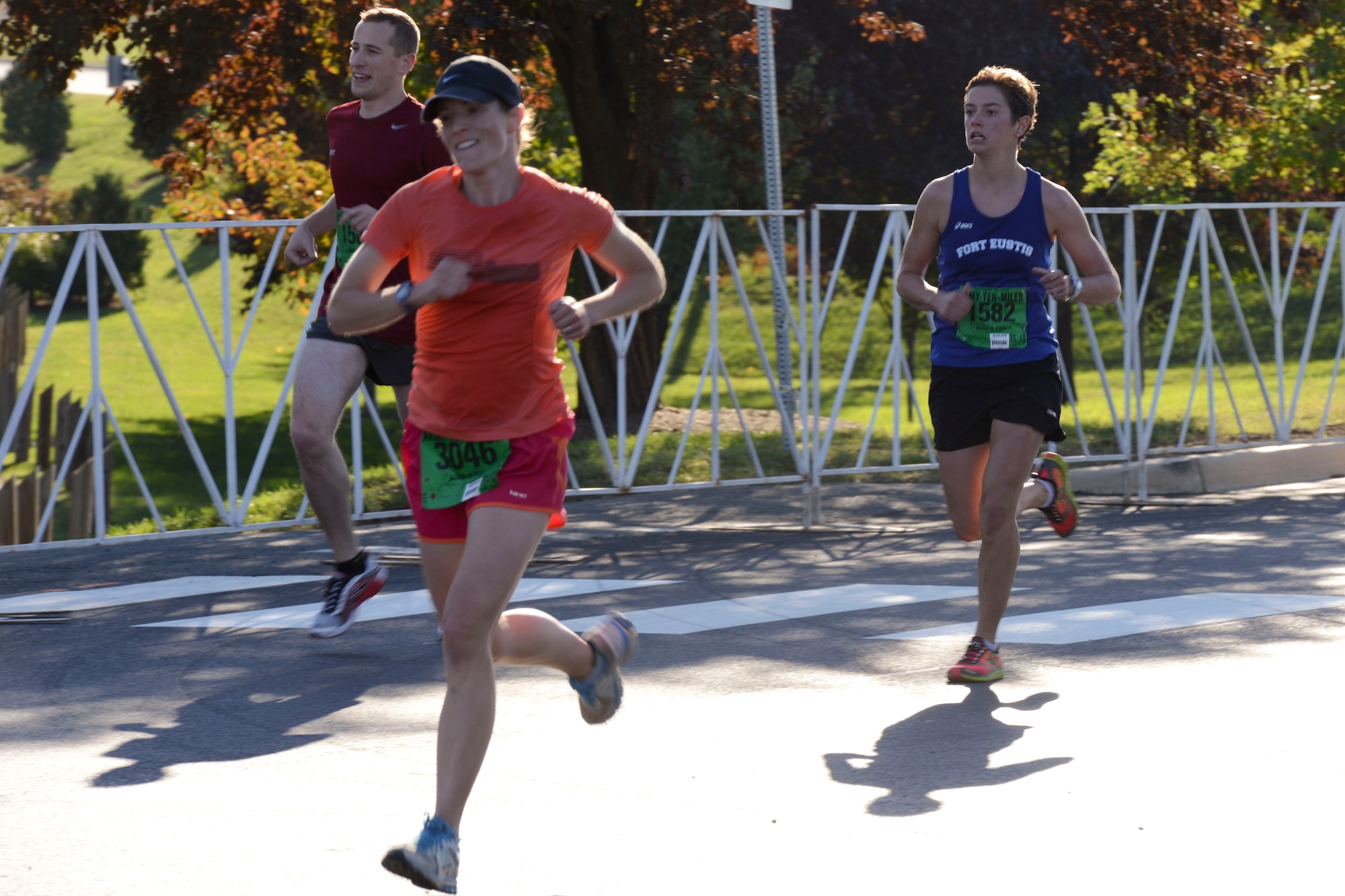 U.S. Army Capt. Christine Krueger, far right, Fort Eustis Ten-Mile team member, races toward the finish line at the U.S. Army Ten-Miler race in Washington, D.C., Oct. 20, 2013. Runners from around the world compete in the race annually. (U.S. Air Force photo by Staff Sgt. Ciara Wymbs/Released)