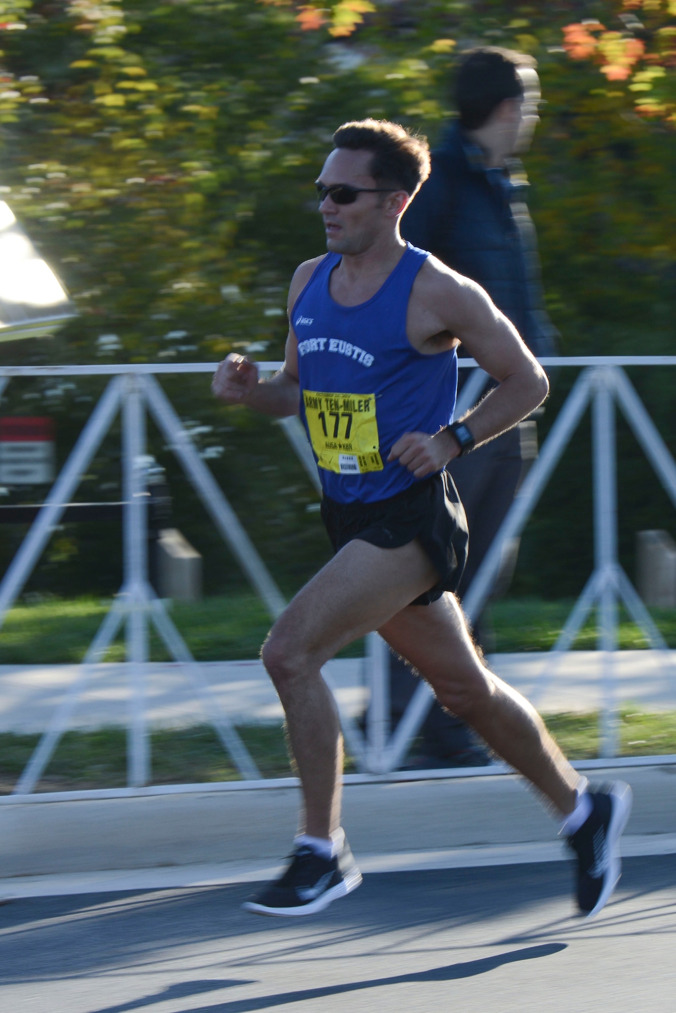 U.S. Army 1st Lt. Bryce Livingston, Fort Eustis Ten-Mile team captain, races to the finish line at the U.S. Army Ten-Miler in Washington, D.C., Oct. 20, 2013. Livingston led the team to first place in the Active Duty Mixed Division category with a time of 52:15. (U.S. Air Force photo by Staff Sgt. Ciara Wymbs/Released) 