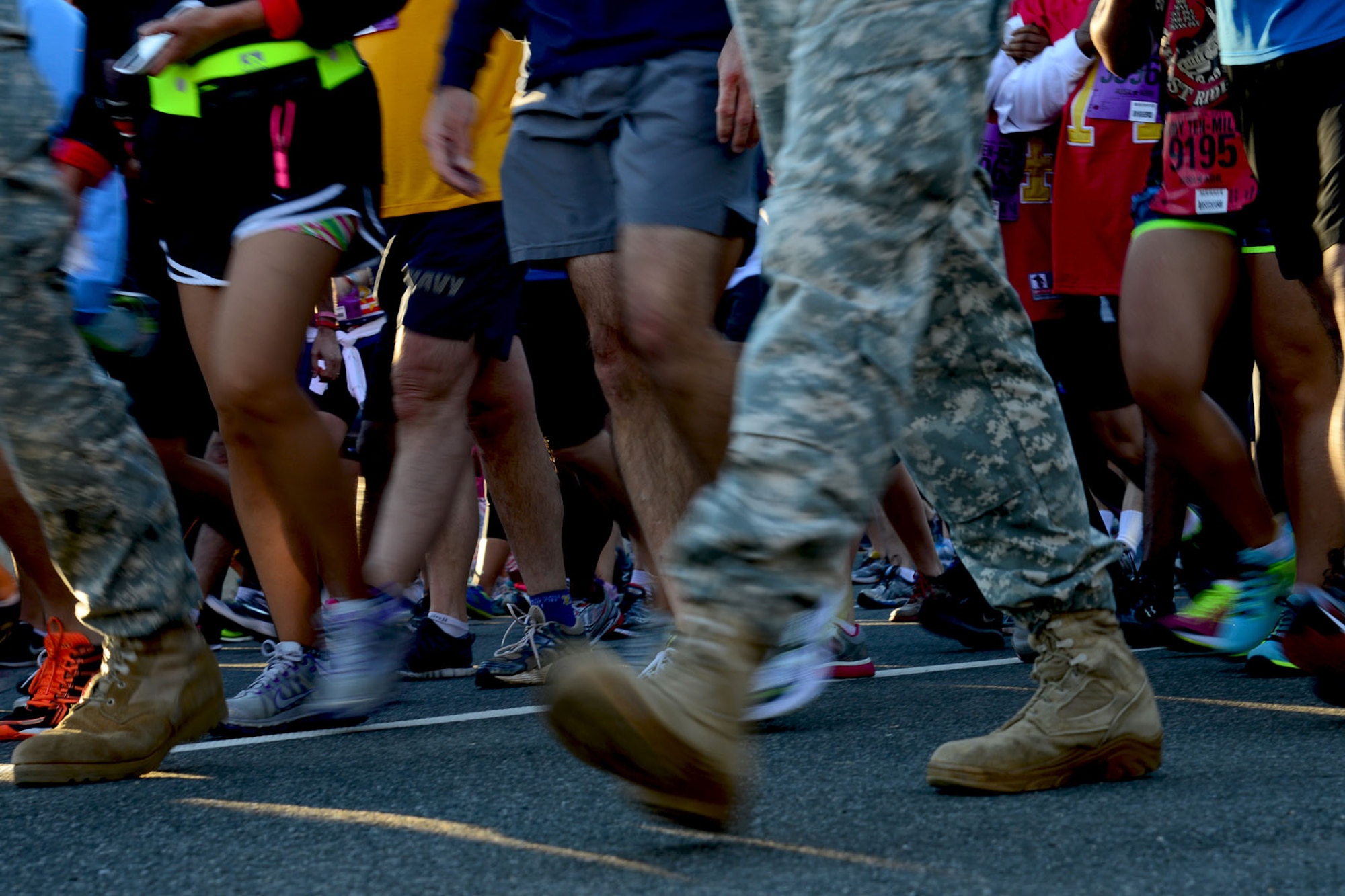 U.S. Army volunteer Soldiers guide runners to the start line before the Army Ten-Miler race in Washington, D.C., Oct. 20, 2013. This year was the 29th year the annual race was held, with 50 percent of the participants being military personnel. (U.S. Air Force photo by Staff Sgt. Ashley Hawkins/Released)