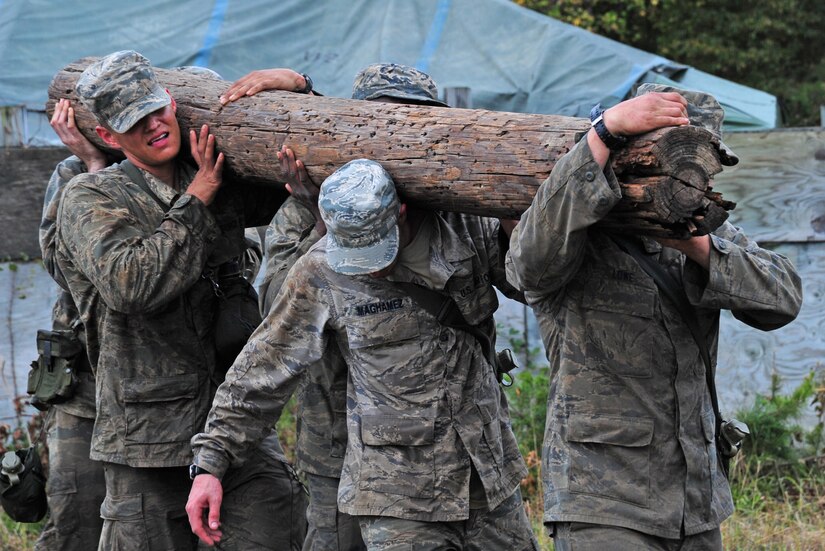Airmen carry tree logs as part of a teambuilding exercise during a Pre-Ranger Assessment Course at Davidsonville Communications Site, Md., Oct. 7, 2013. Continual physical exercise and endurance is reinforced daylong throughout the course to ensure the Airmen have the required strength if they were to be selected for the 62 daylong Army Ranger Course. (U.S. Air Force photo/Airman 1st Class Erin O’Shea)