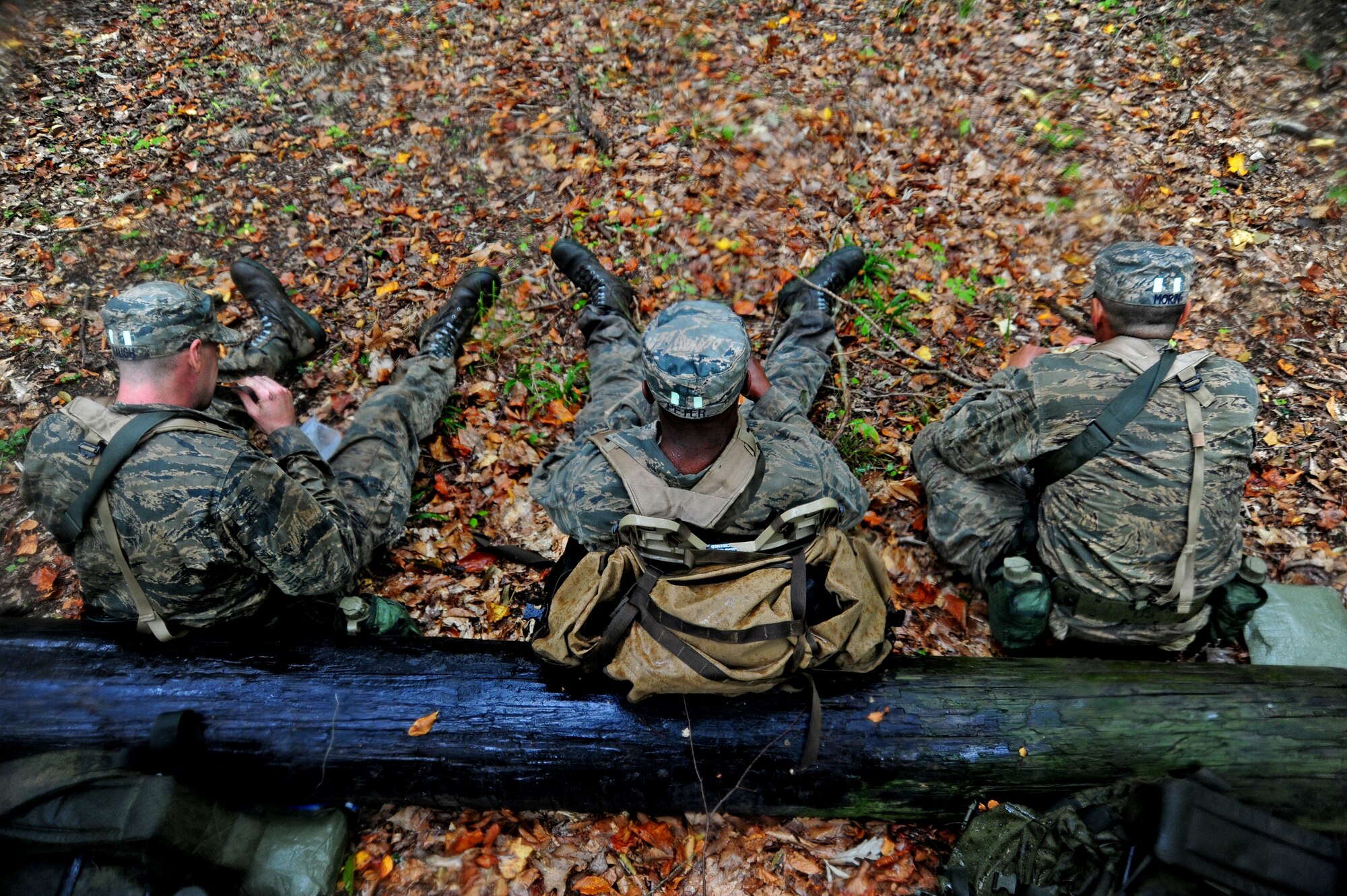 Airmen eat a Meal, Ready-to Eat after completing a 4 hour-long navigation exercise during a Pre-Ranger Assessment Course at Davidsonville Communications Site, Md., Oct. 7, 2013. Because the course is so demanding, having time to eat and replenish their bodies is crucial. (U.S Air Force photo/Airman 1st Class Erin O’Shea) 