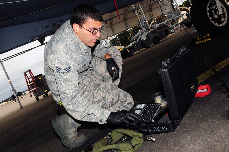 U.S. Air Force Senior Airman Brian Pagel, 4th Aircraft Maintenance Squadron avionics specialist, reviews a technical order during a load crew competition at Seymour Johnson Air Force Base, N.C., Oct. 18, 2013. Technical orders provide maintainers with diagrams and instructions for sustaining aircraft. (U.S. Air Force photo by Airman 1st Class John Nieves Camacho)