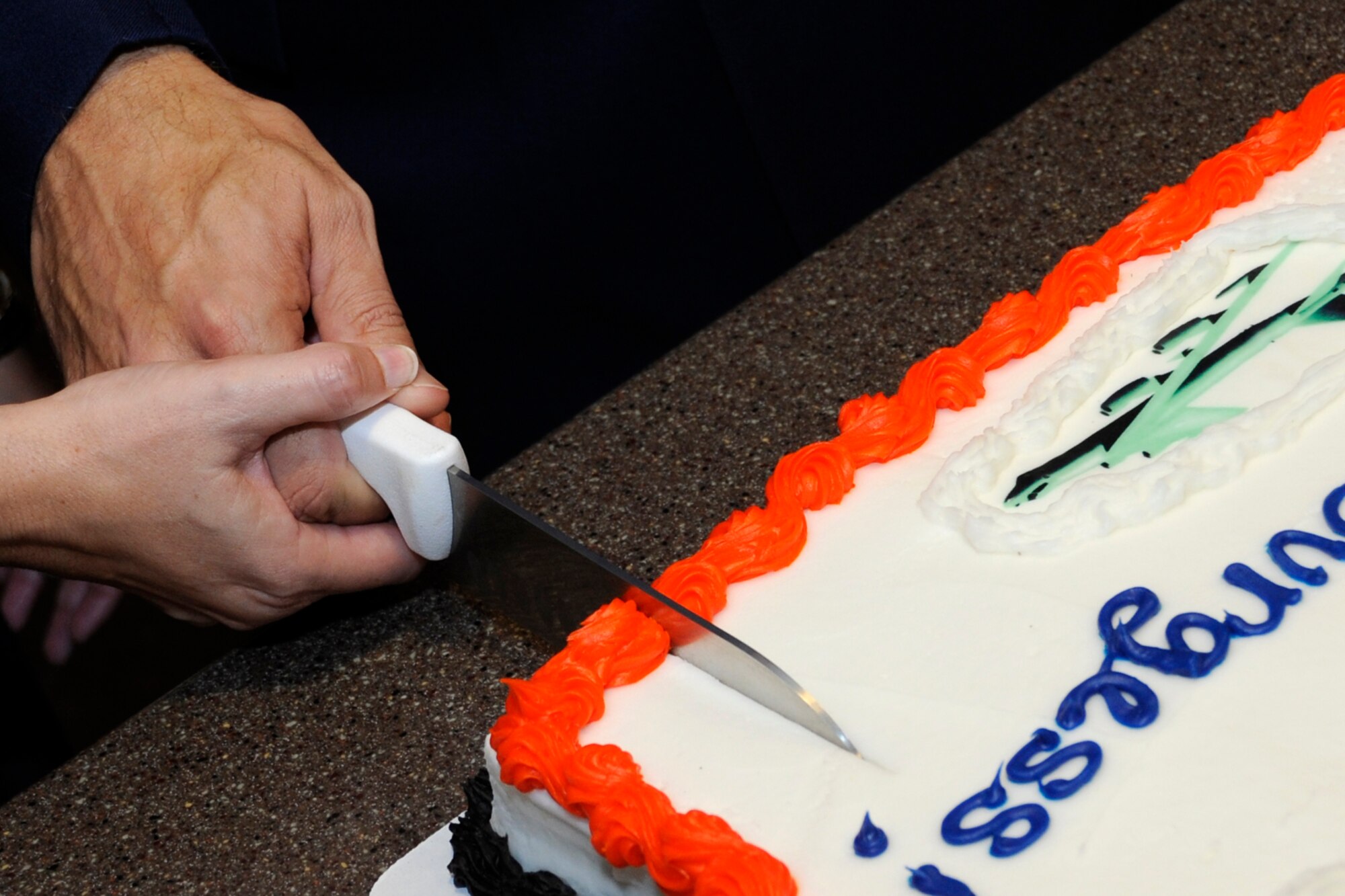 Lt. Col.  Robert N. Burgess, commander, 343rd Bomb Squadron, and his wife Martha, cut the cake after the change of command ceremony for the 343 BS at the 93rd Bomb Squadron Headquarters building on Barksdale Air Force Base, La., Oct. 21, 2013. Burgess became the third commander for the 343 BS, which was officially reactivated on April 1, 2010, at Barksdale. The unit’s rich history dates back to World War II, where for combat operations against the enemy, the 343 BS earned the Distinguished Unit Citation for actions in North Africa and Sicily, August 1942 - August 1943. It was awarded another DUC for participation in the low-level assault on oil refineries at Ploesti, Rumania, Aug. 1, 1943. (U.S. Air Force photo by Master Sgt. Jeff Walston)